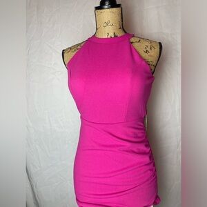 Short tight fitted pink dress. With open back